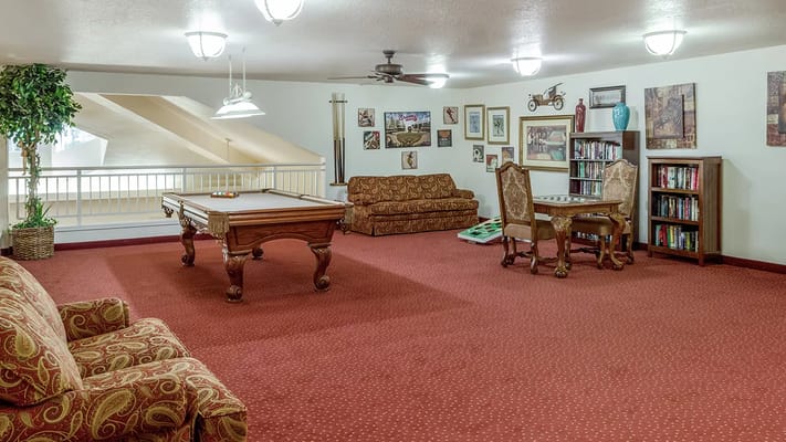 Common area with pool table and seating