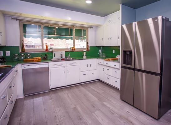 Bright kitchen area with modern appliances