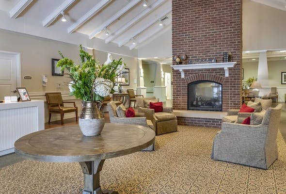 Bright common area with seating and floral arrangement