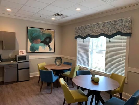 Bright common area with colorful seating and artwork