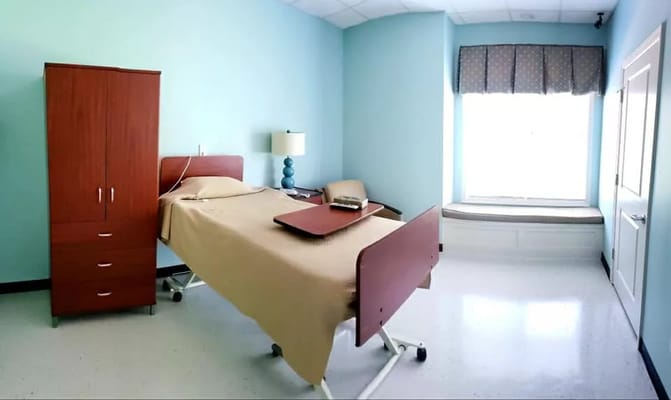 Colorful resident room with bed and furniture