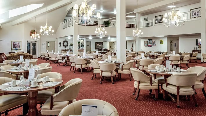 Dining room with tables set for a meal