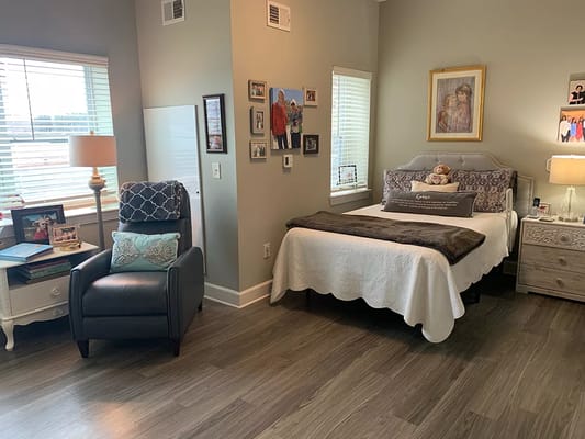 Cozy resident room with personal touches and natural light