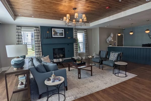 Common area with seating and a decorative fireplace