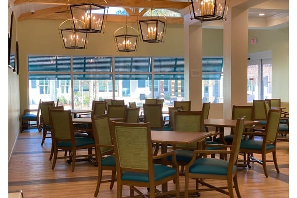 Bright dining area with tables and chairs