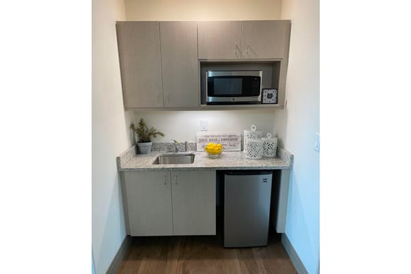 Modern kitchenette in a resident suite