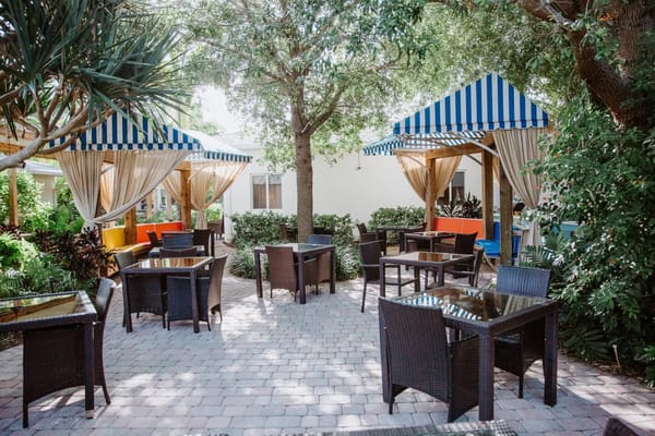 Outdoor seating area with colorful canopies