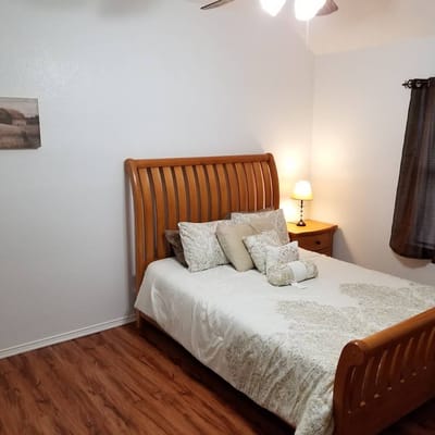 Cozy private resident room with bed and decor