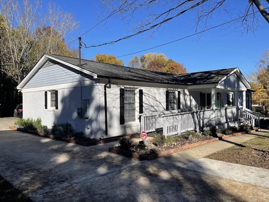 Exterior view of a senior living facility with landscaped entrance