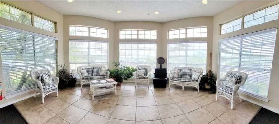 Bright common area with comfortable seating and plants
