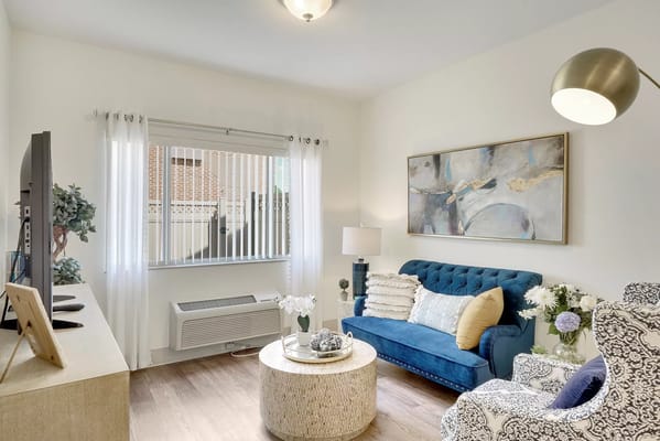 Comfortable living room with blue sofa and artwork