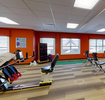 Interior view of a fitness room with exercise equipment