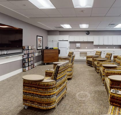 Interior view of a common area with colorful chairs