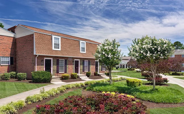 Beautiful garden and exterior of Abbington Landing Apartments