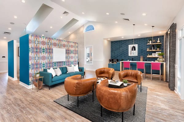 Modern lobby seating area with a colorful accent wall