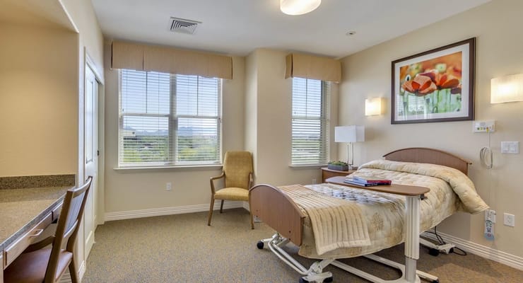 Comfortable resident room with a bed and window