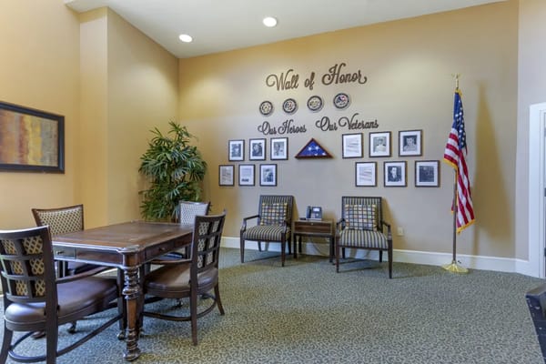 Common area featuring a Wall of Honor with photos