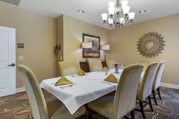 Dining area set for a meal with elegant table settings