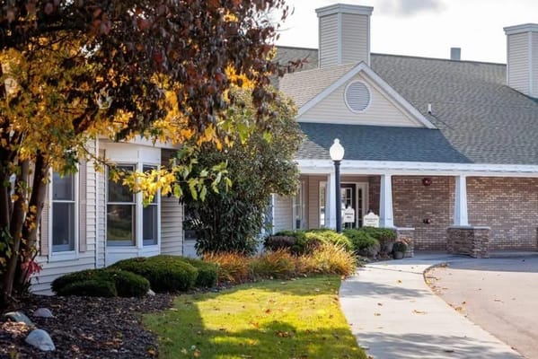 Exterior view of the Addington Place senior living facility with fall foliage.