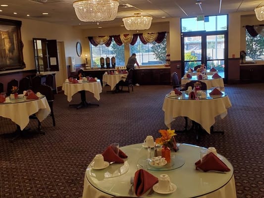 Elegant dining room setup with tables and decorations
