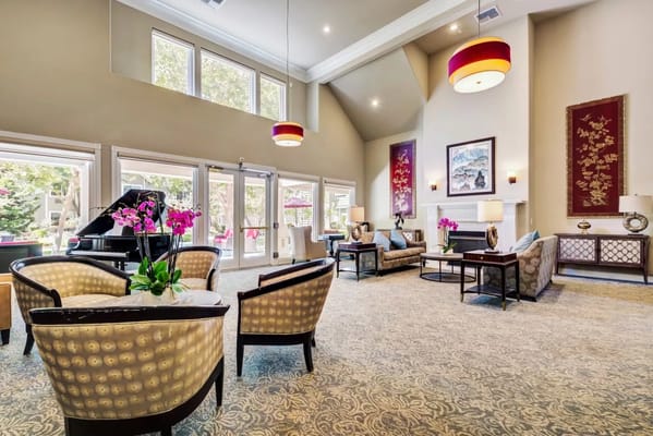 Bright common area with seating and floral decor