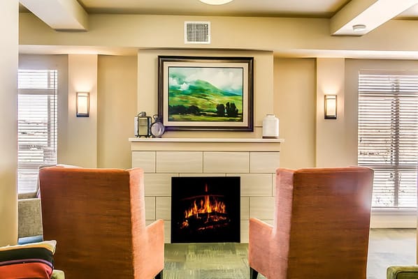 Cozy common area with a fireplace and seating