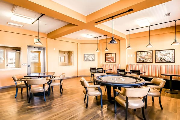 Bright common area with seating and entertainment options