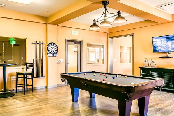 Interior common area with a pool table and seating