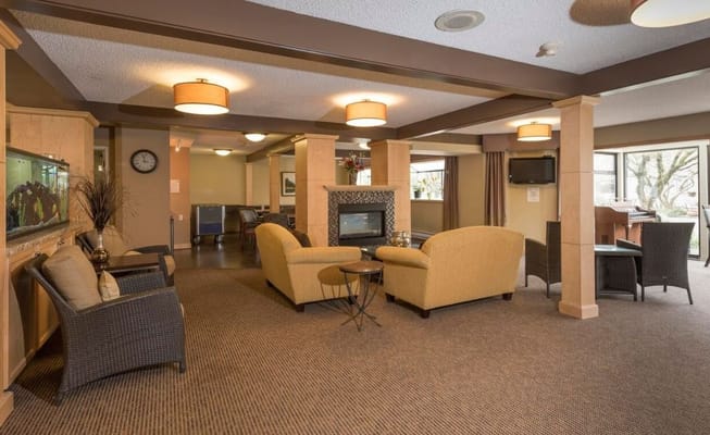 Bright common area with seating and natural light