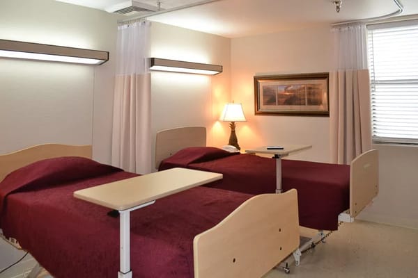 Private resident room with two adjustable beds