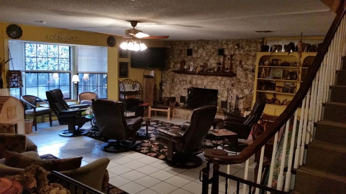 Cozy common area with comfortable seating and a fireplace