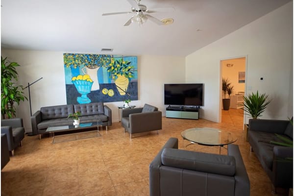 Bright common area with modern seating and art