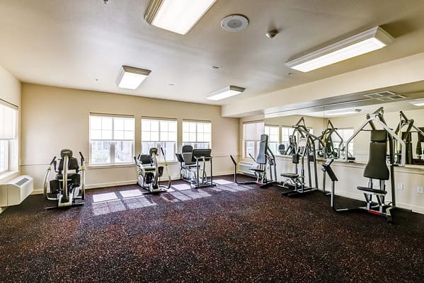 Interior view of a fitness area with exercise machines