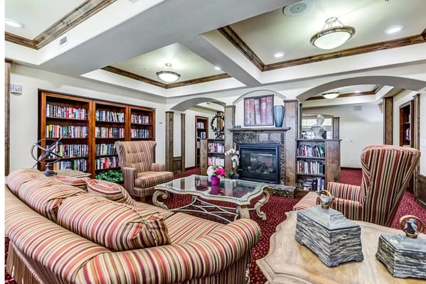 Comfortable common area with bookshelves and seating