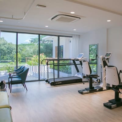 Bright and airy fitness area with equipment and outdoor view
