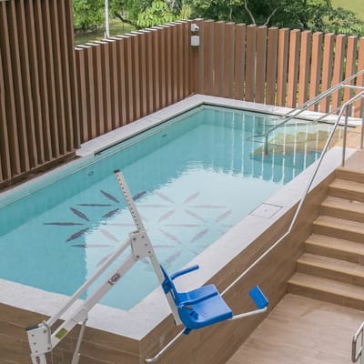 Accessible swimming pool with a lift chair