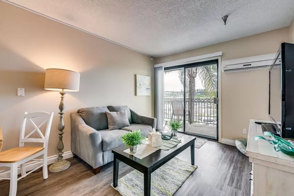Cozy living room with sofa and balcony view