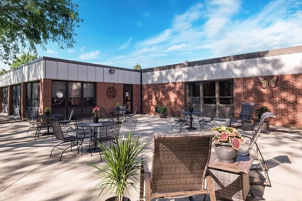 Outdoor patio with seating at a senior living facility