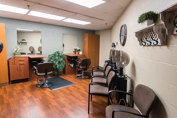 Interior of a hair salon with styling chairs and mirrors