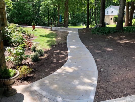 Curved walkway in a landscaped outdoor area