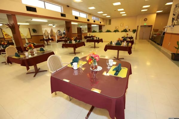Dining room with tables set for meals