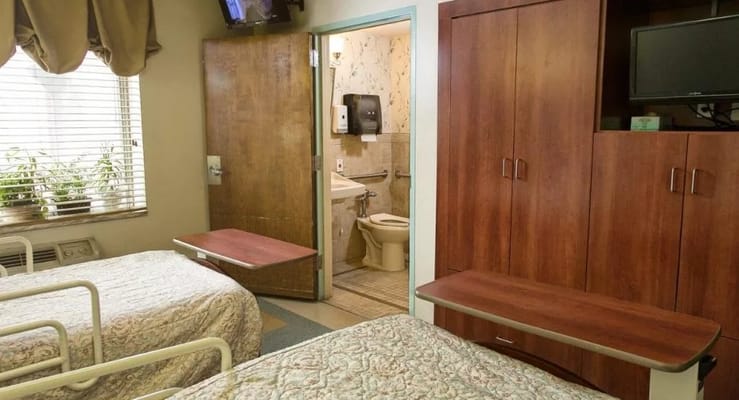 A shared resident room with two beds