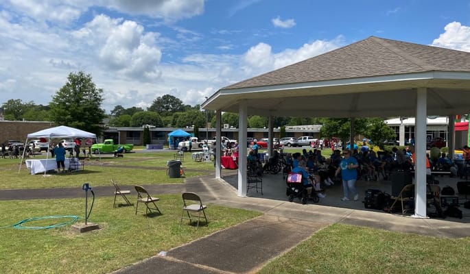 Gathering of residents and staff at an outdoor event