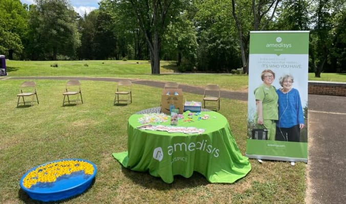 Outdoor event setup with staff and activities