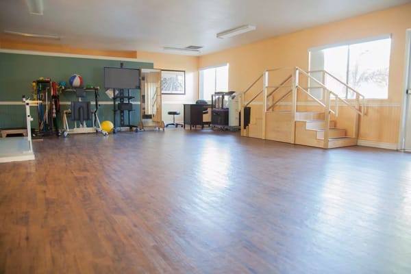 Bright interior of an activity room with exercise equipment
