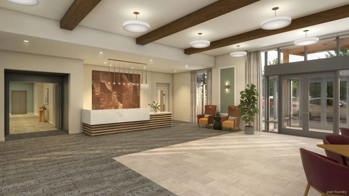 Interior lobby of a senior living facility with seating