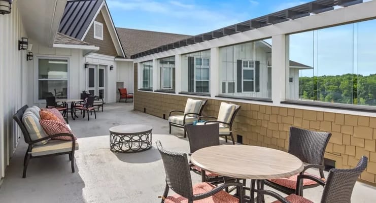 Outdoor terrace area with seating for residents