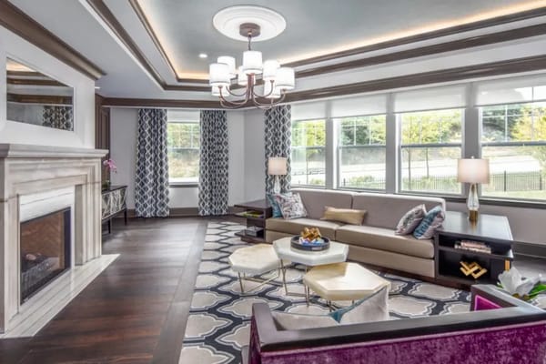 Spacious living room with contemporary decor and large windows