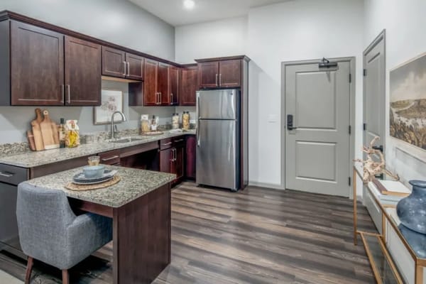 Modern kitchen with granite countertops and stainless steel appliances