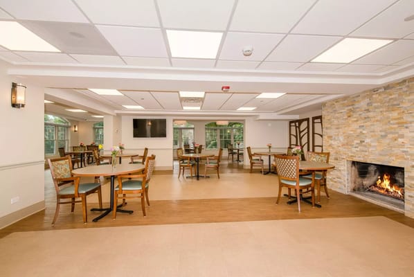 Bright common area with tables and chairs